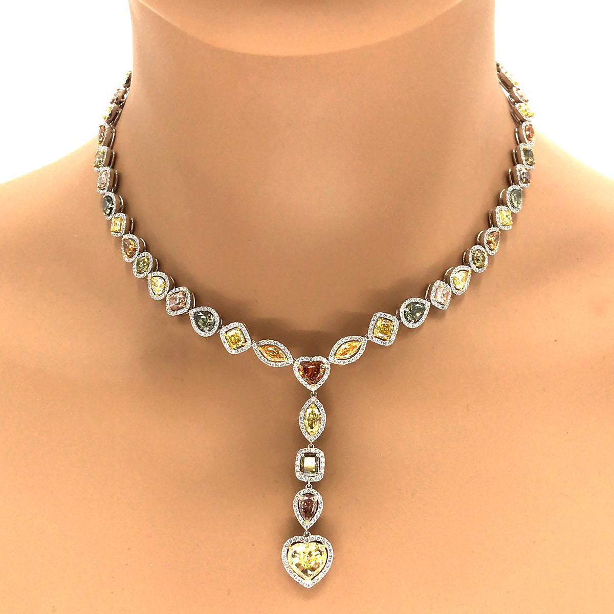 gold necklace with white stone designs