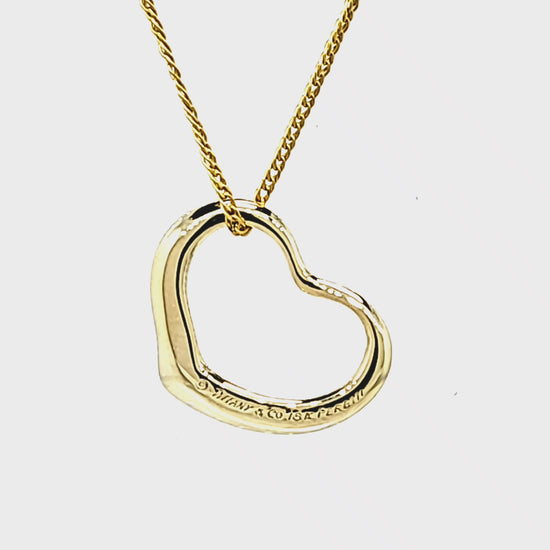 Load and play video in Gallery viewer, Pre-Owned Tiffany and Co. Elsa Peretti Medium Open Heart Pendant
